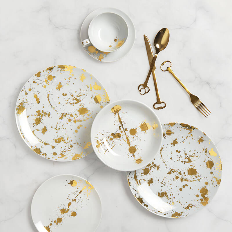 servizio piatti porcellana bianca e oro